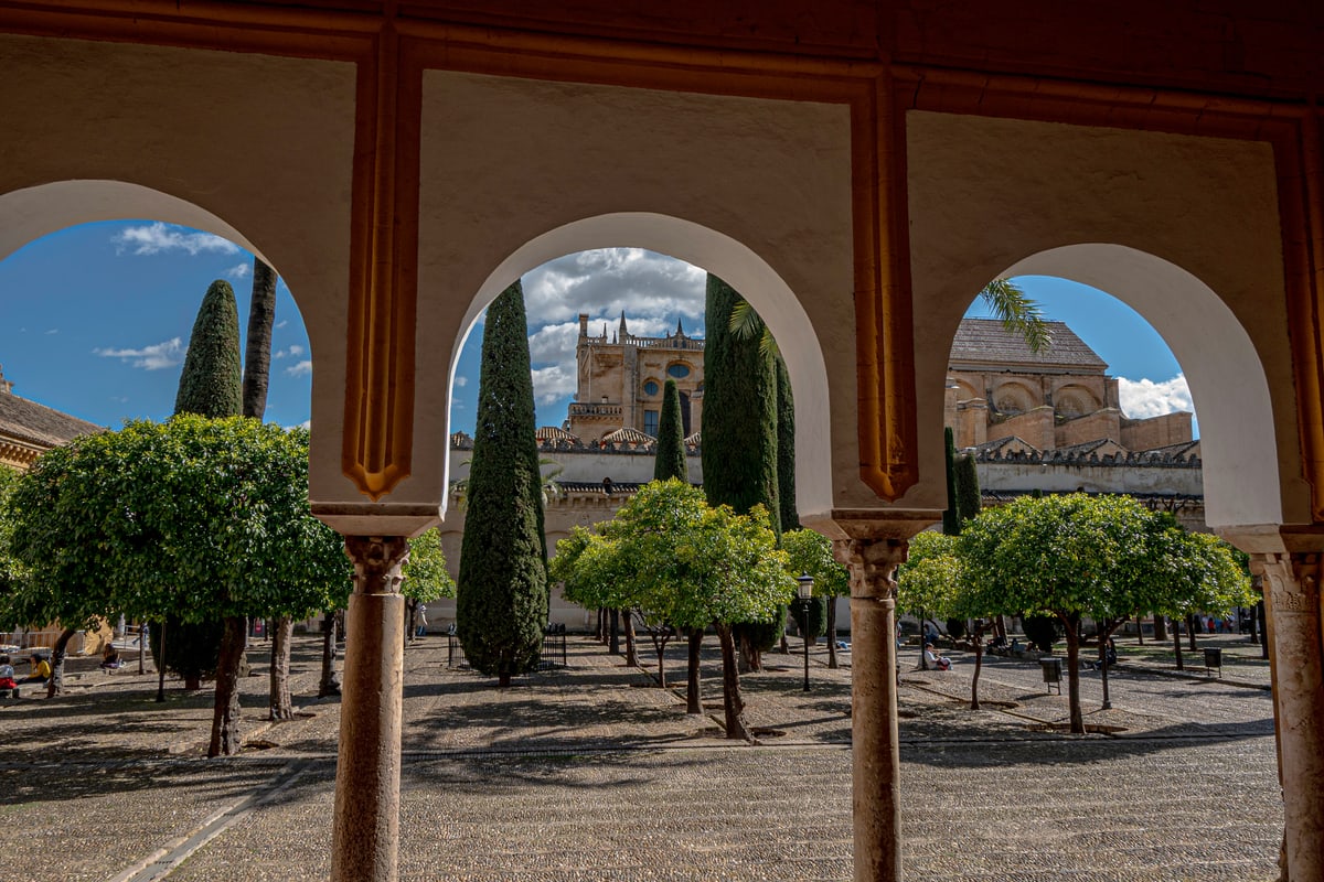Horseshoe arches frame the orange-tree courtyard of the Mezquita in Córdoba.