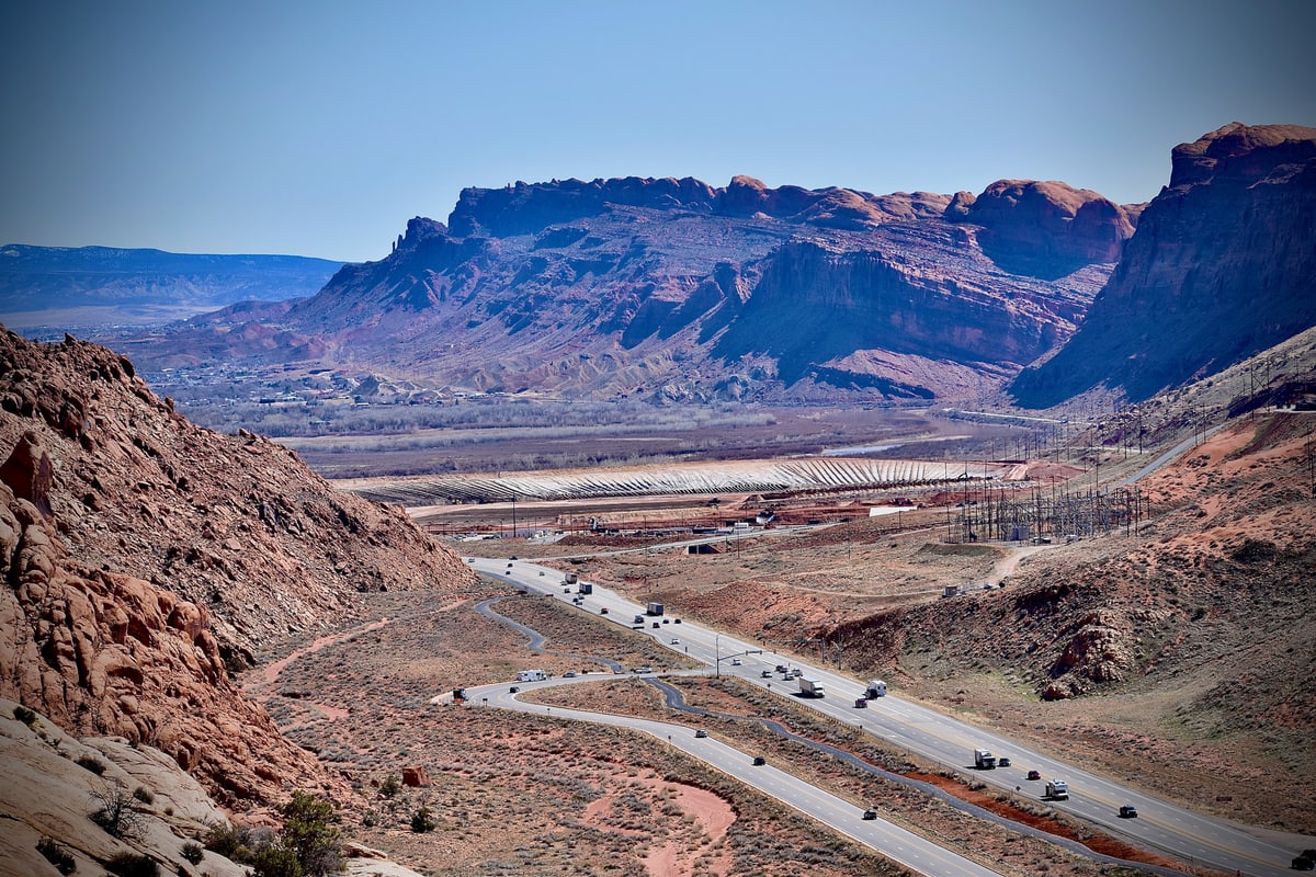 A highway winds through red canyon walls near Moab, Utah.